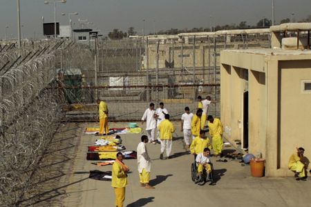 Detainees are seen outside their cell block at the U.S. detention facility at Camp Cropper in Baghdad, Iraq, Monday, Nov. 10, 2008. The U.S. military is rushing to collect evidence against some 5,000 detainees deemed to be dangerous _ including suspected members of al-Qaida in Iraq _ in case it loses the right to hold prisoners indefinitely without charge at the end of the year. (AP Photo)